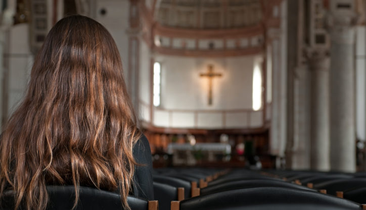 Praying in the church (Horizontal)