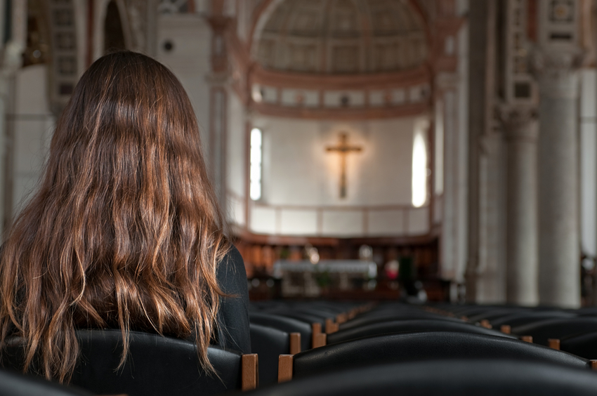 Praying in the church (Horizontal)